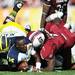 Michigan quarterback Devin Gardner falls to the ground after loosing his helmet in the second quarter against South Carolina in the Outback Bowl in Tampa, Fla. on Tuesday, Jan. 1. Melanie Maxwell I AnnArbor.com